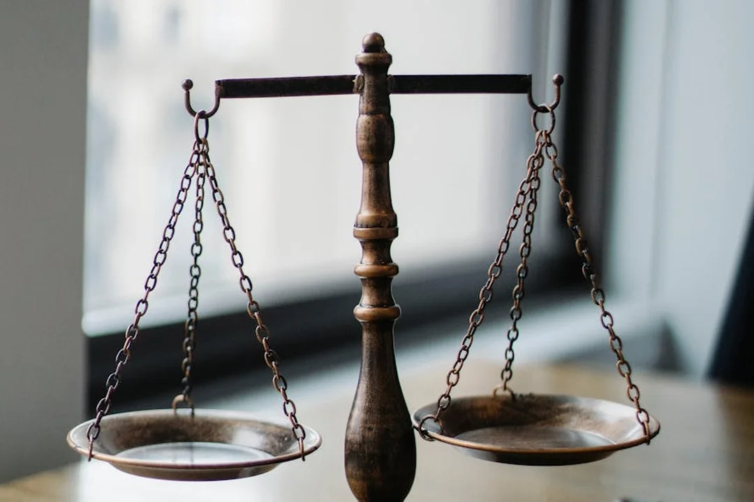 A traditional balance scale symbolizing legal standards and limits on HOA fines
