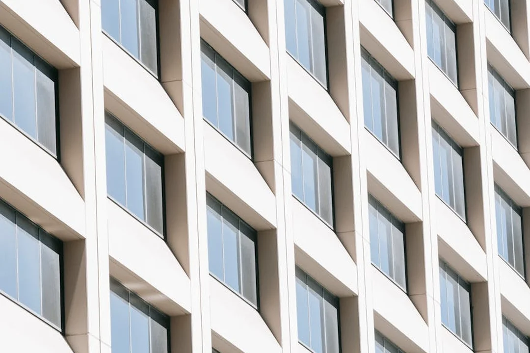 Close-up of a modern building facade with a repeating pattern of windows