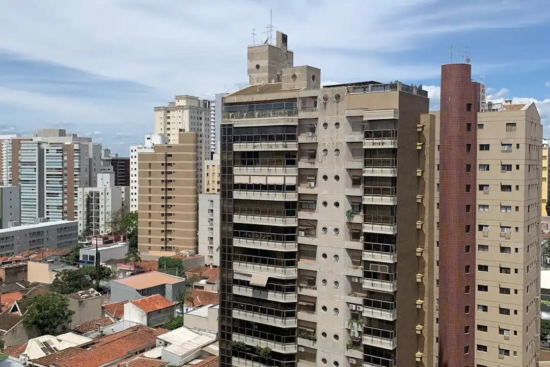 Urban cityscape showing a cluster of tall residential buildings with balconies, illustrating a dense shared living environment typical of a POA.