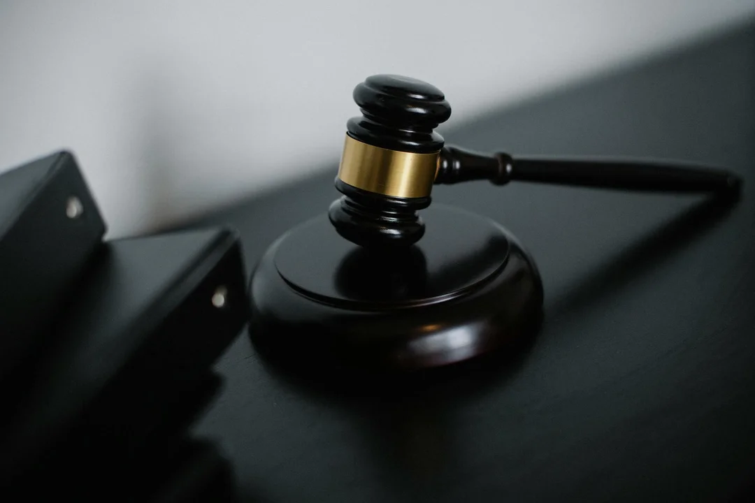 A judge's gavel on a dark wooden surface, symbolizing the legal grounds for dissolving an HOA.