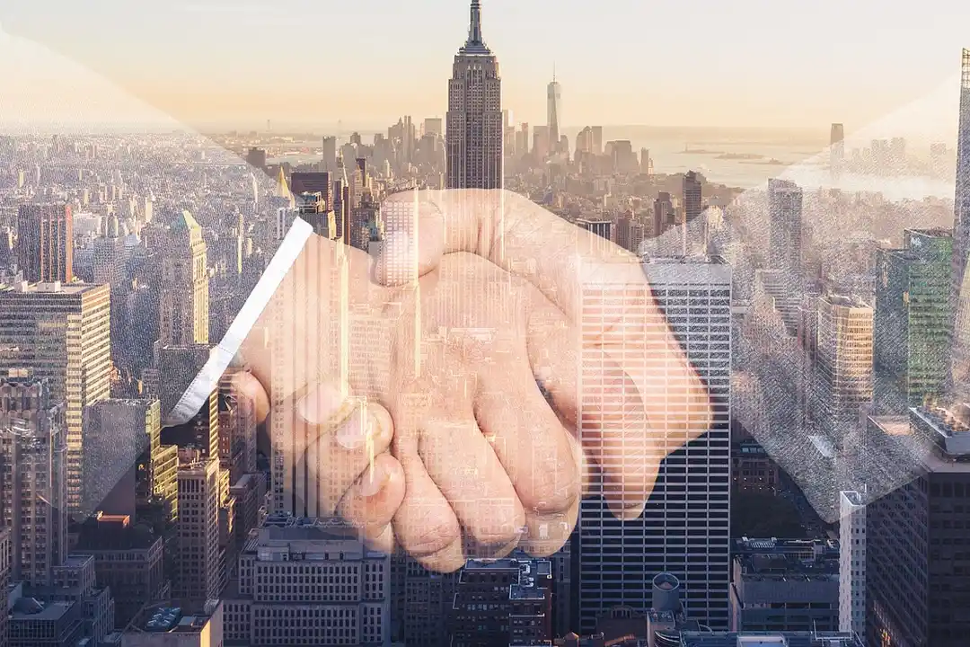 Handshake overlaid on a city skyline, symbolizing resolving HOA disputes.