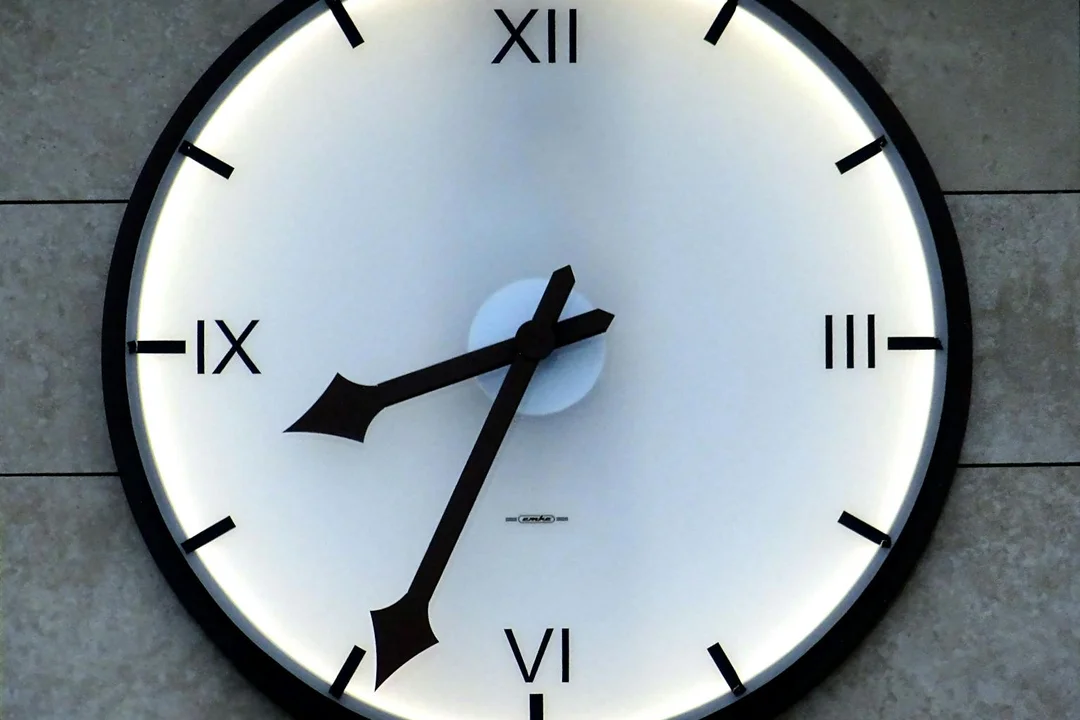 Wall clock with Roman numerals symbolizing the timing and duration of HOA approvals