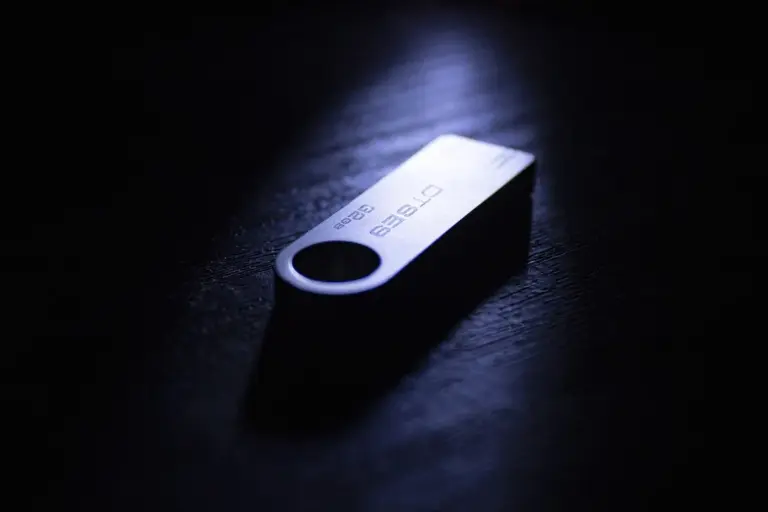 USB flash drive on a dark, moody surface, symbolizing digital access to HOA documents