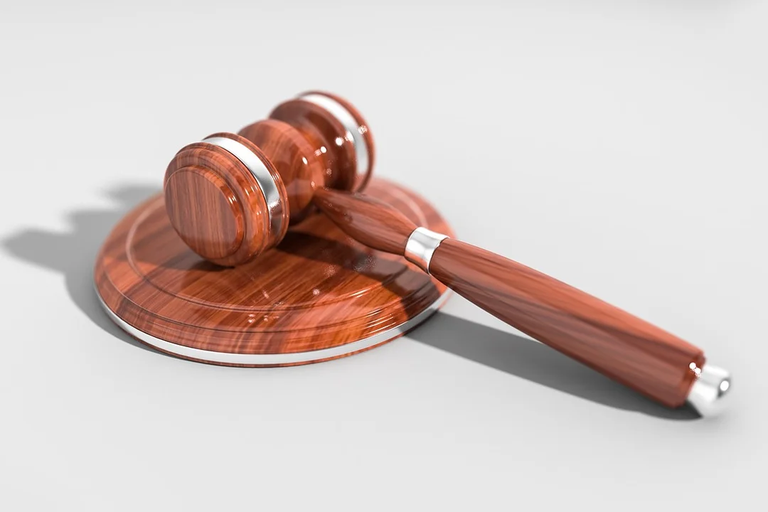 Wooden gavel resting on a sound block, symbolizing HOA enforcement actions and legal proceedings