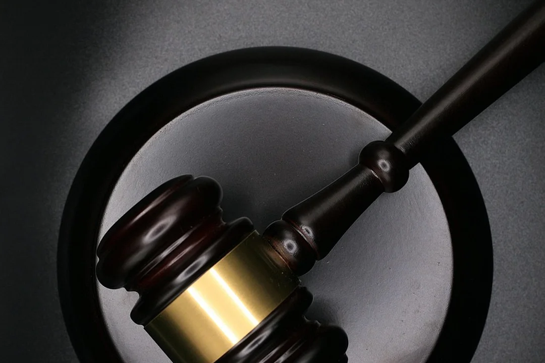 Gavel inside a circular frame, symbolizing fiduciary oversight and governance