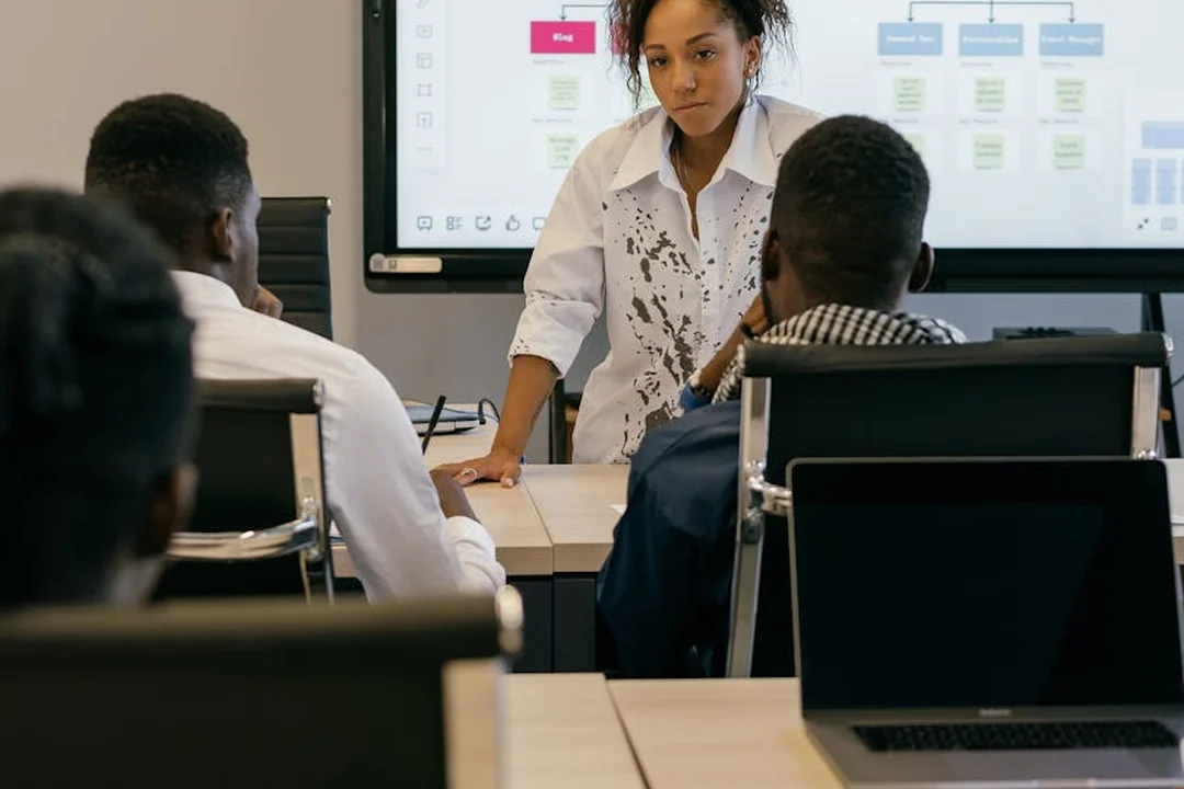 Instructor leads a governance and compliance training session for HOA board members in a classroom.