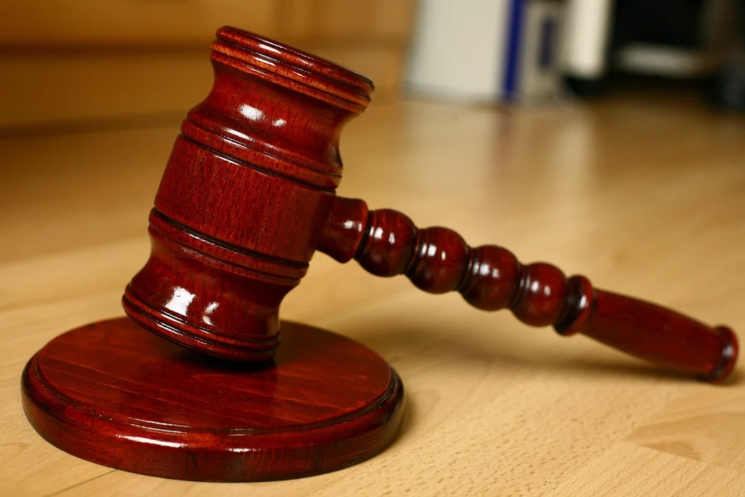 Wooden judge's gavel on a light wooden surface, symbolizing legal procedures for HOA amendments