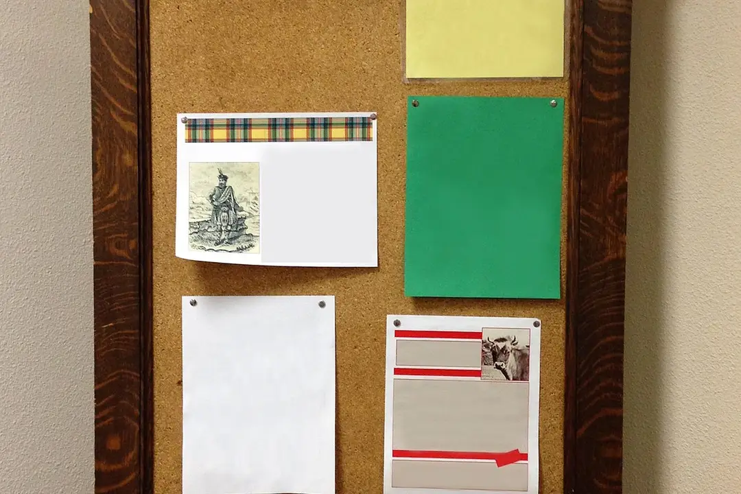 Corkboard with various papers and notes pinned, symbolizing layered governance between a master association and its sub-associations.