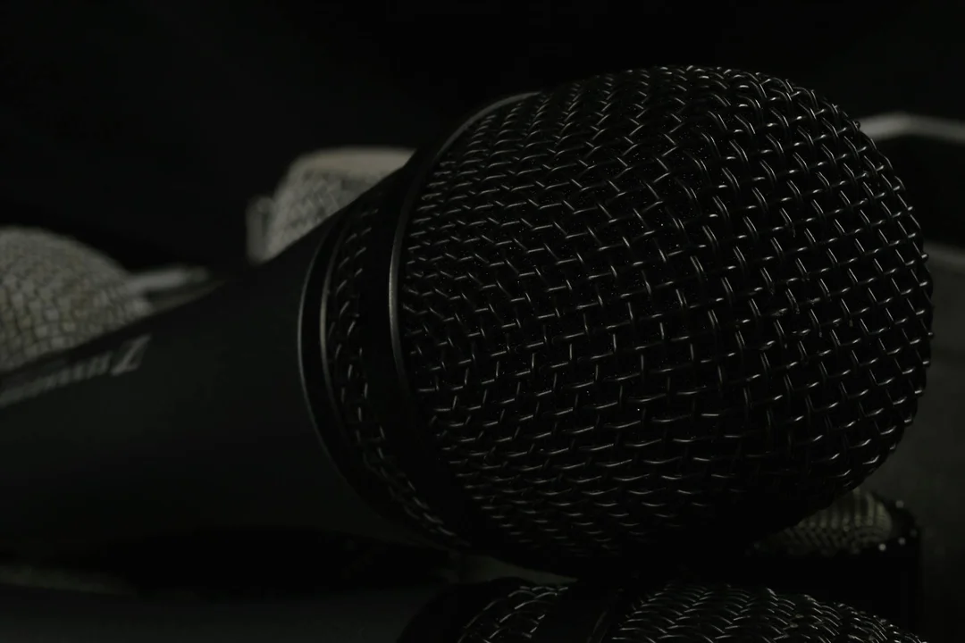 Close-up of a microphone on a dark background, symbolizing speaking up at an HOA meeting