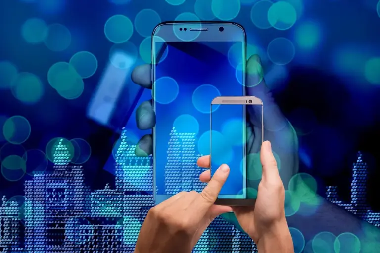 Hands holding a smartphone in front of a blue, bokeh-lit cityscape, representing smart home technology.